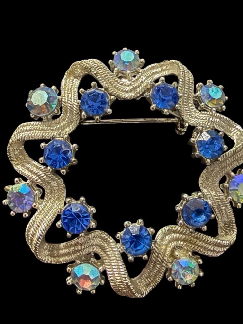 Gold-Tone Wavy Circle Brooch with Blue and Aurora‎ Borealis Stones